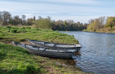 fly fishing boats on the bank of the River Tweed